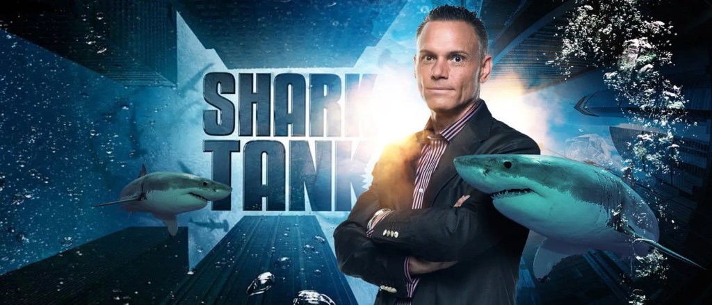 A man in a suit with the Shark Tank logo