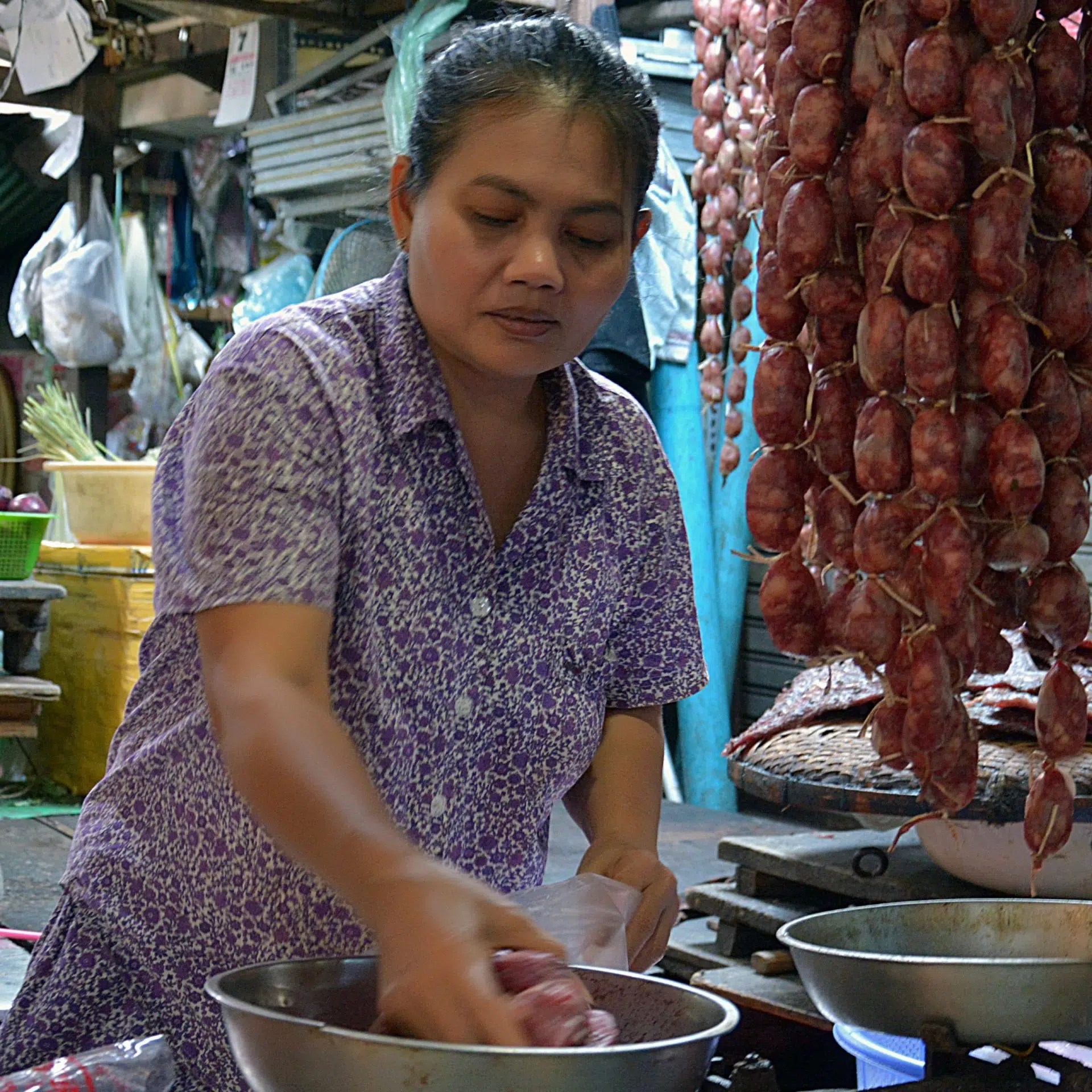 A woman preparing meat